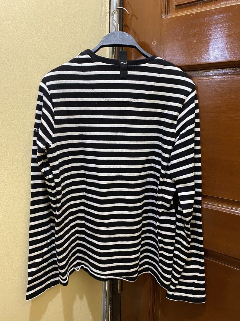 Marc Jacobs Striped Long Sleeve Shirt (Category: Longsleeves) located in Manila. Submitted by haveago0dthrift (Listing ID 1460151296, Image 3). Description: - Classic black and white striped long-sleeved shirt - Brand: Marc Jacobs - Subtle brand name detail on sleeve - Larger tag detail on the side - Material: 100% Cotton - Made in Portugal - Comfortable and stylish for everyday wear - Versatile wardrobe staple - Width 1.5 - Length 4.