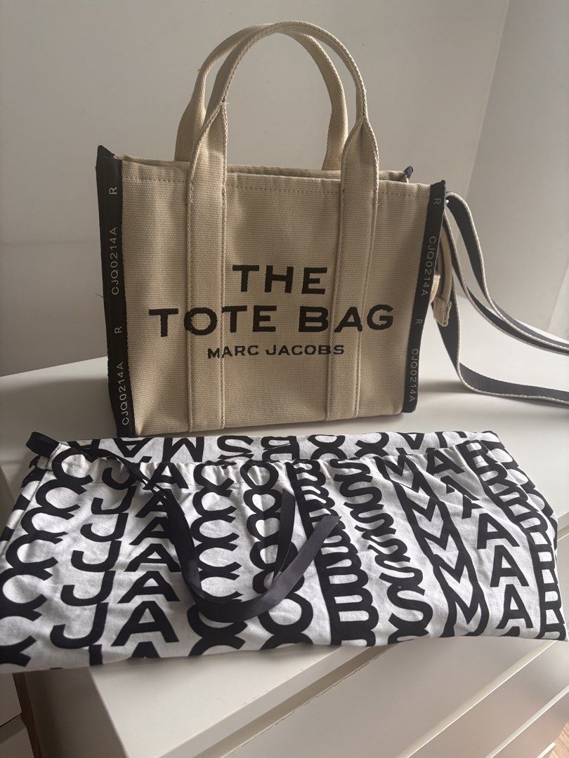 Marc Jacobs The Tote Bag Canvas Beige (Category: Luxury Bags & Wallets) located in Manila. Submitted by dfp4g6pf5g62929 (Listing ID 1460139332, Image 1). Description: - Authentic Marc Jacobs The Tote Bag - Color: Beige - Material: Canvas - Includes original dust bag - Ideal for everyday use - Spacious interior - Comfortable straps - Feel free to ask any questions!.