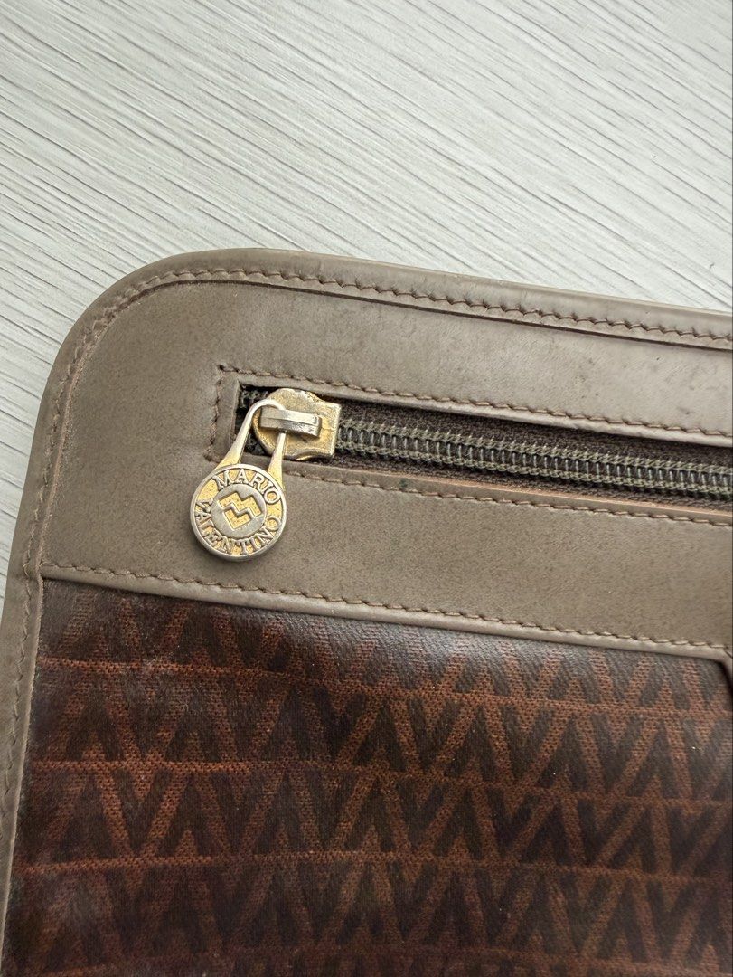 Mario Valentino brown monogram clutch bag (Category: Belt bags, Clutches and Pouches) located in Quezon City. Submitted by shopgood_mnl (Listing ID 1460264143, Image 2). Description: .