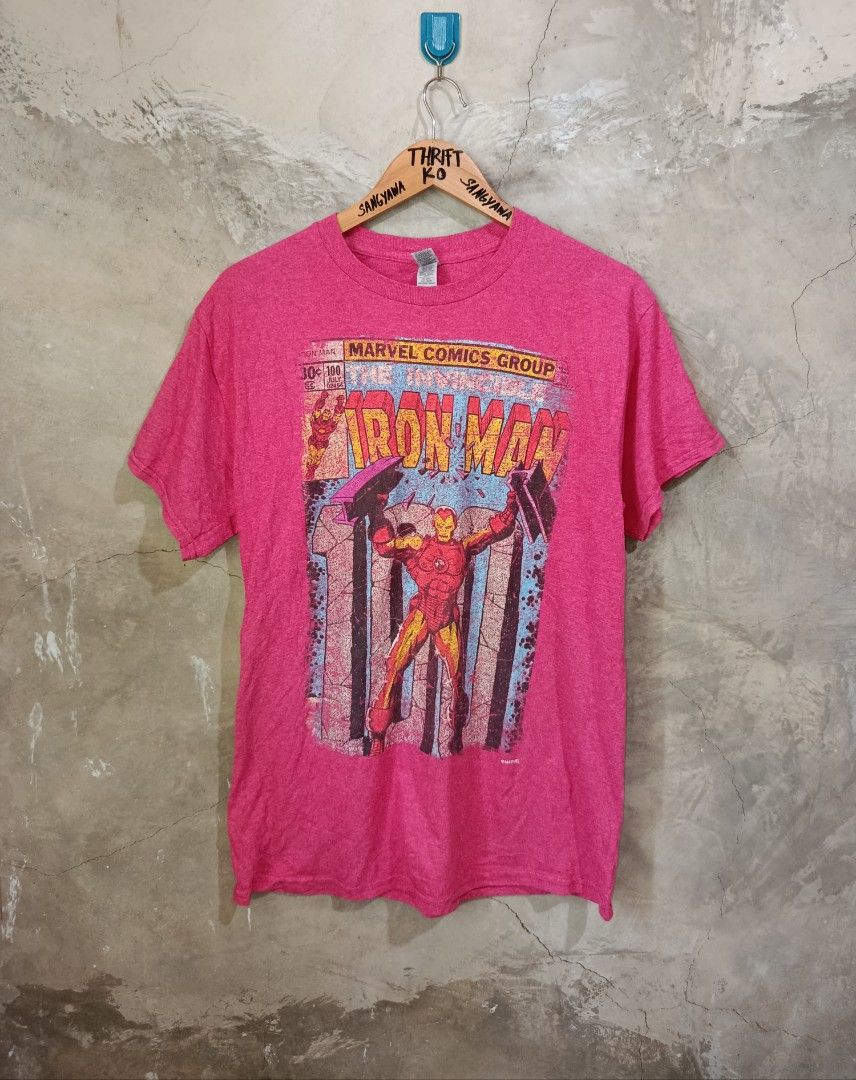 Marvel Comics Iron Man Graphic T-Shirt (Category: Tshirts & Polo Shirts ) located in Kalamansig. Submitted by skone1996 (Listing ID 1460248554, Image 1). Description: - Pink Gildan t-shirt - Features Iron Man comic graphic - Includes Marvel Comics Group logo - Text: 'The Invincible Iron Man' - Material: Cotton blend - Size: Medium - 21 Width - 28 Length - 9.8/10 Color rate - No Issue - Ideal for Marvel fans.