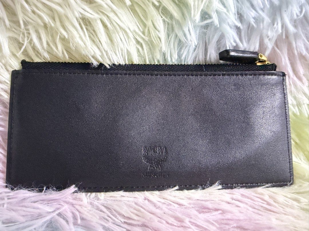 MCM Long Card Holder / Insert Wallet — Black Leather (Category: Luxury Bags & Wallets) located in Rizal. Submitted by affordabagz (Listing ID 1460261604, Image 1). Description: 📌 Item Details: • Brand: MCM München — embossed logo on smooth black leather • Type: Long Card Holder / Zip Insert Wallet — slim design, 6 card slots + full-length zip compartment at the back • Zipper: Gold-tone hardware, marked 3Y (authentic MCM zipper code — YKK/Lampo v