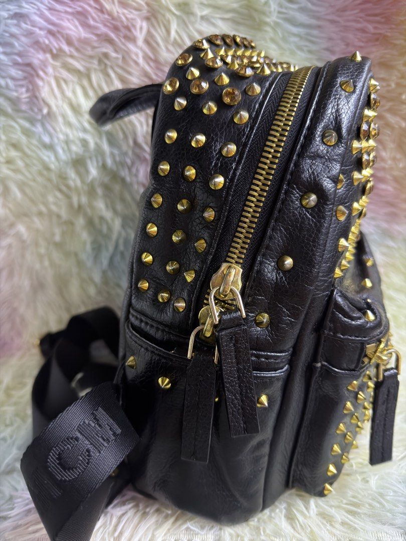 MCM Studded Mini Backpack (Category: Luxury Bags & Wallets) located in Rizal. Submitted by affordabagz (Listing ID 1460225304, Image 3). Description: ⚠️ Condition: • Outside conditioned with leather conditioner ✨ • Interior NOT fully clean — signs of use present 🫧 • Edges & corners show wear / rubbing — see photos 📸 • Zippers & hardware tarnish / discoloration — see close-ups • All photos show actual condition — zoom to see details! ❗ IMPORTANT