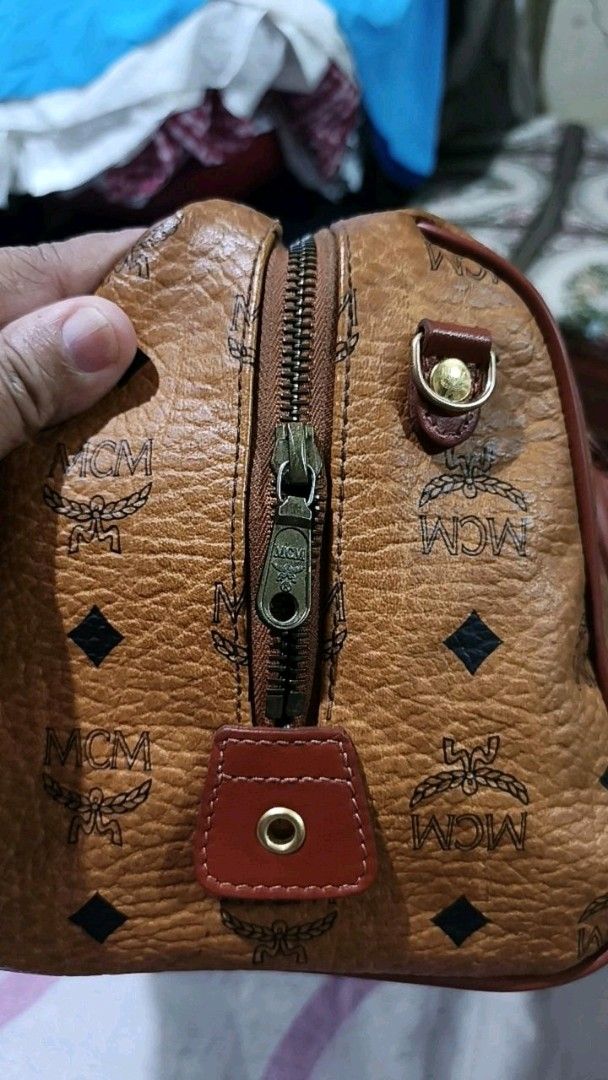 MCM Visetos Boston Bag (Category: Luxury Bags & Wallets) located in Paranaque City. Submitted by bagdbags (Listing ID 1460161679, Image 3). Description: - Classic MCM Boston bag - Iconic Visetos print (brown/black monogram) - Leather trim and handles - Detachable shoulder strap included - Zipper closure - Gold hardware details - Ideal for everyday use or travel.