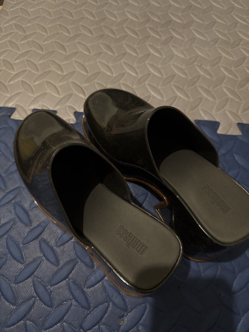 Melissa Black Jelly Mules Clogs (Category: Flats & Sandals) located in Makati City. Submitted by malcolmkenji (Listing ID 1460210749, Image 3). Description: - Melissa black jelly mules - Easy slip-on style - Features Melissa logo on soles - Fun and stylish clog-like design - Perfect for casual wear or dressing up an outfit.