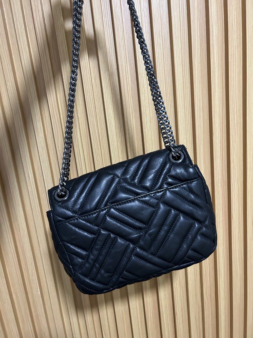 MICHAEL KORS - PEYTON SHOULDER/CROSSBODY FLAP BAG (Category: Luxury Bags & Wallets) located in Dasmarinas. Submitted by pseudonym. (Listing ID 1460132162, Image 2). Description: black quilted leather Michael Kors Peyton medium shoulder flap bag featuring a diagonal chevron pattern and a chain strap. EXCELLENT CONDITION USED / NO FLAWS feel free to inquire quick replies.