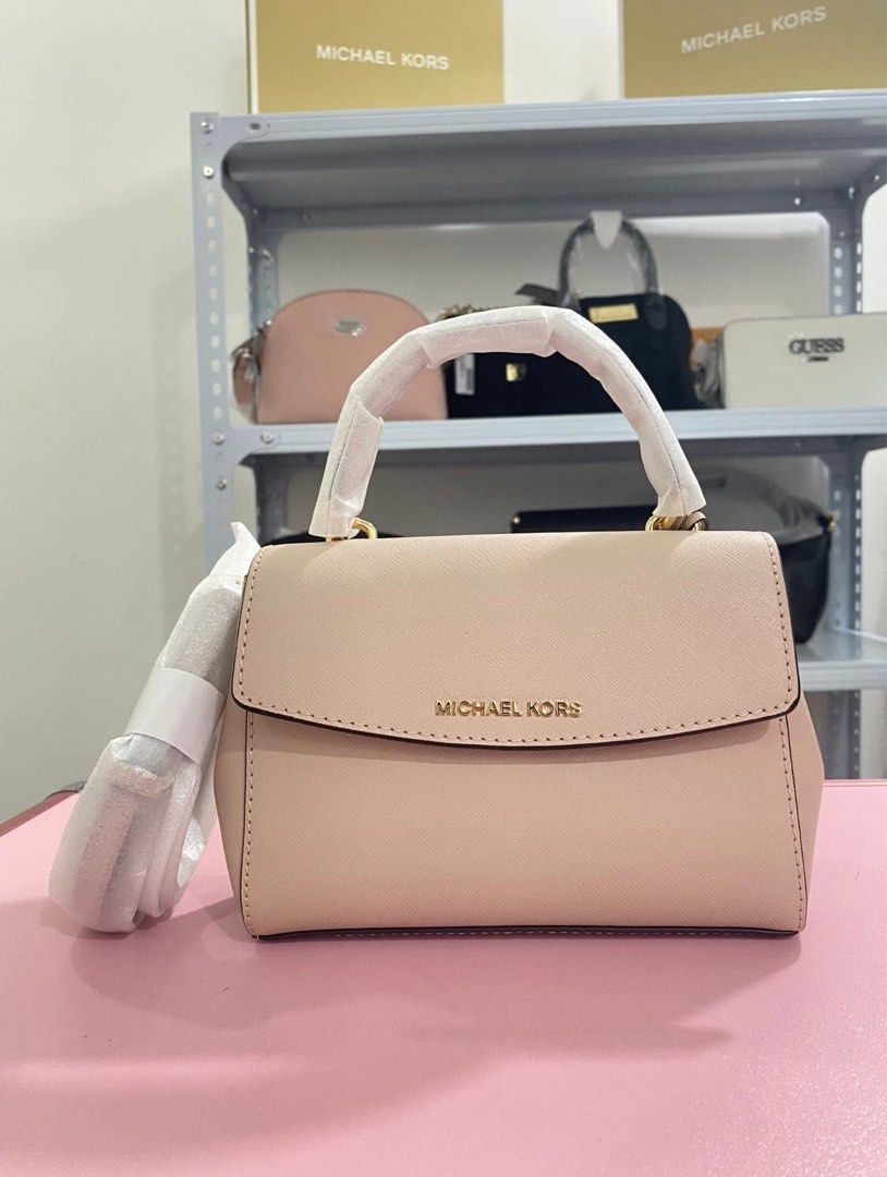 Michael Kors Pink Leather Top Handle Bag (Category: Luxury Bags & Wallets) located in Manila. Submitted by forlenn (Listing ID 1460296766, Image 1). Description: Michael Kors top handle bag in a lovely light pink. Saffiano leather. Comes with a detachable shoulder strap. Gold hardware details. Clean interior. Great for everyday use or special occasions..