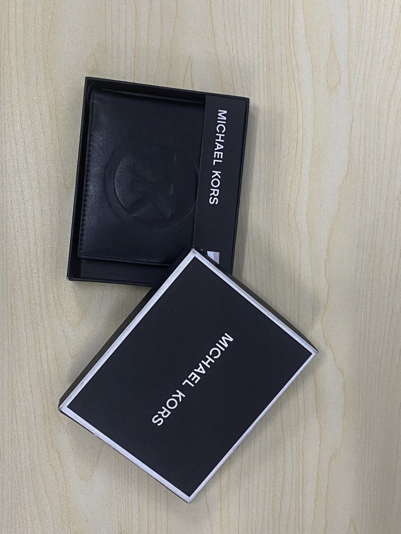 Michael Kors Slim Billfold Wallet Black (Category: Wallets & Card holders) located in Pasig City. Submitted by tamtam_obra (Listing ID 1460201797, Image 3). Description: - Genuine Black Michael Kors Slim Billfold Wallet - Features embossed MK logo on the front - Comes with original Michael Kors box - Ideal for keeping your cards and cash neatly organized.