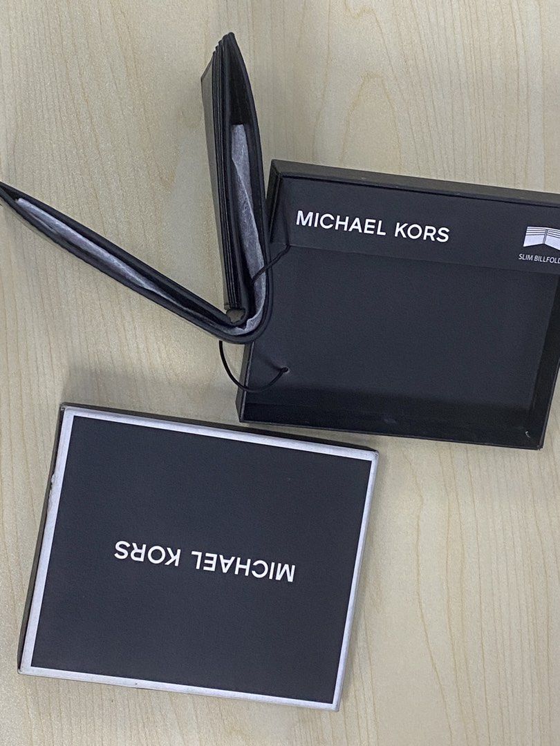Michael Kors Slim Billfold Wallet Black (Category: Wallets & Card holders) located in Pasig City. Submitted by tamtam_obra (Listing ID 1460201797, Image 2). Description: - Genuine Black Michael Kors Slim Billfold Wallet - Features embossed MK logo on the front - Comes with original Michael Kors box - Ideal for keeping your cards and cash neatly organized.
