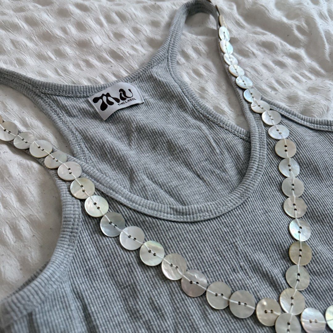 Miu the Label Button Tank in Grey (Category: Sleeveless) located in Mandaluyong City. Submitted by shesellsseashells_bear (Listing ID 1460190921, Image 2). Description: 2 missing buttons Got this for 1,350.