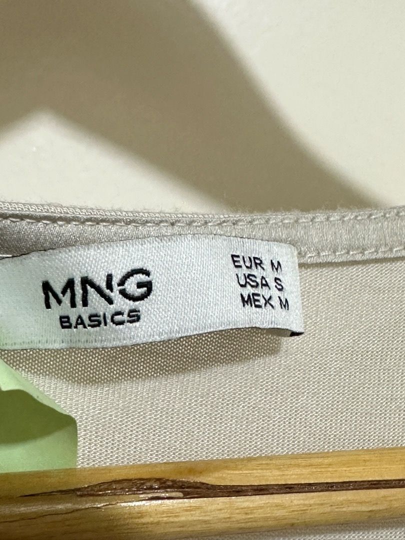 MNG Basics V-neck Cap Sleeve Top Size S (Category: Blouses) located in Mandaluyong City. Submitted by lovedbyjaaaam (Listing ID 1460272319, Image 2). Description: - Lightweight MNG Basics top - V-neck with short cap sleeves - Fabric has a subtle sheen - Great for casual wear or dressing up - Easy to pair with different bottoms.