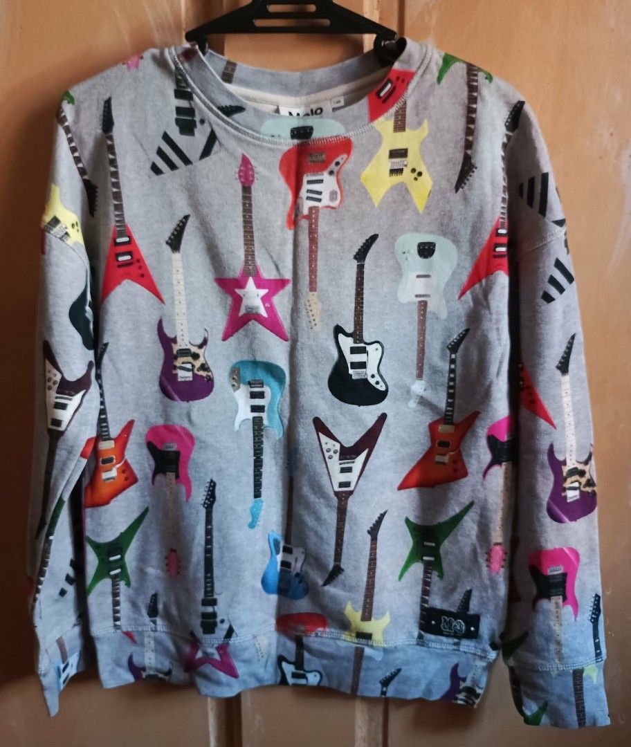 Molo Grey Guitar Print Sweatshirt Size 140 (Category: Babies & Kids Fashion) located in Cebu City. Submitted by violacloset (Listing ID 1460260049, Image 1). Description: - all in good condition mostly are worn once some are none at all. measurements: width: 17 1/2 in length: 22 in arm length: 18 in.