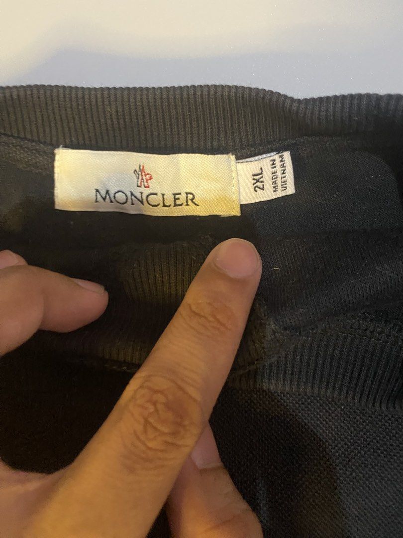 Moncler Black Sweatshirt 2XL (Category: Coats, Jackets and Outerwear) located in Manila. Submitted by syke.archiveorg (Listing ID 1460142293, Image 3). Description: - Moncler Crewneck Sweatshirt - Color: Black - Size: 2XL - Features classic Moncler logo on chest - Made in Vietnam - Ideal for casual wear.