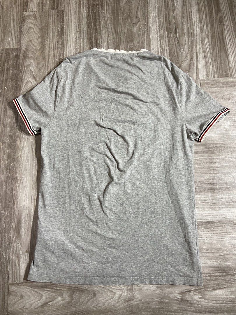 Moncler V-Neck Stretch Cotton Grey (Category: Tshirts & Polo Shirts ) located in Cebu City. Submitted by jvlz97 (Listing ID 1460125654, Image 2). Description: Very Good Condition Sign of usage barely Visible Pinhole that can be seen on the last photo Dimes W21" L 29".