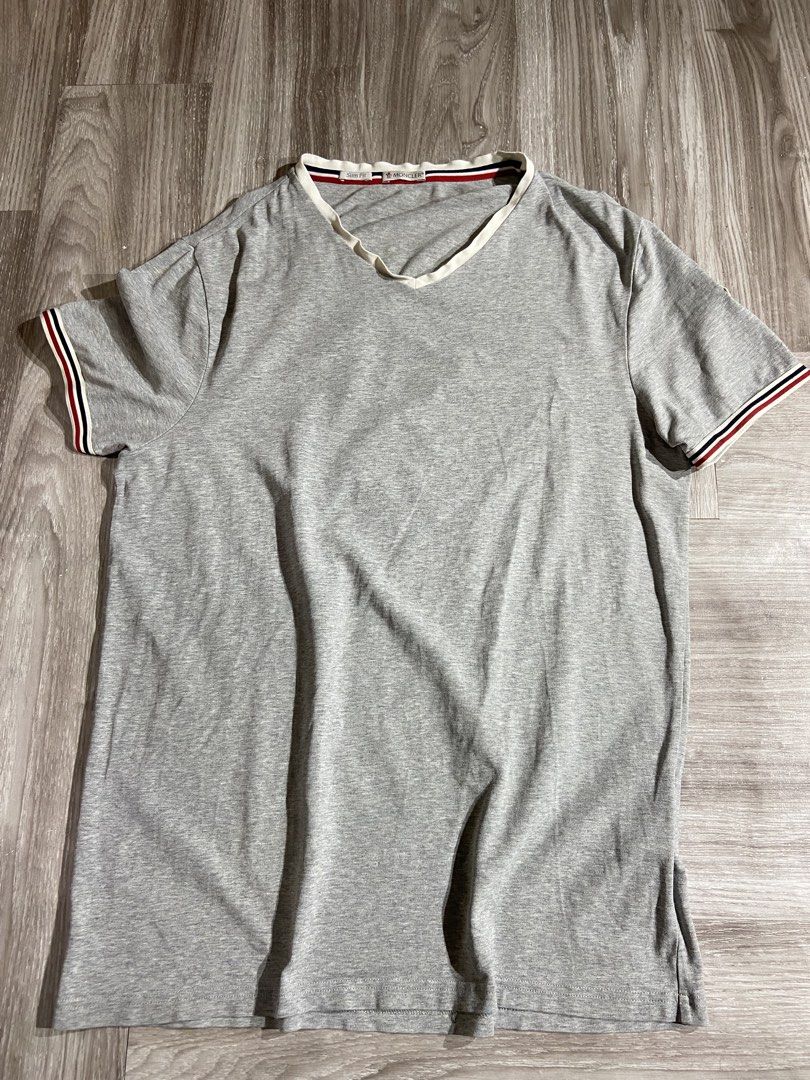 Moncler V-Neck Stretch Cotton Grey (Category: Tshirts & Polo Shirts ) located in Cebu City. Submitted by jvlz97 (Listing ID 1460125654, Image 1). Description: Very Good Condition Sign of usage barely Visible Pinhole that can be seen on the last photo Dimes W21" L 29".