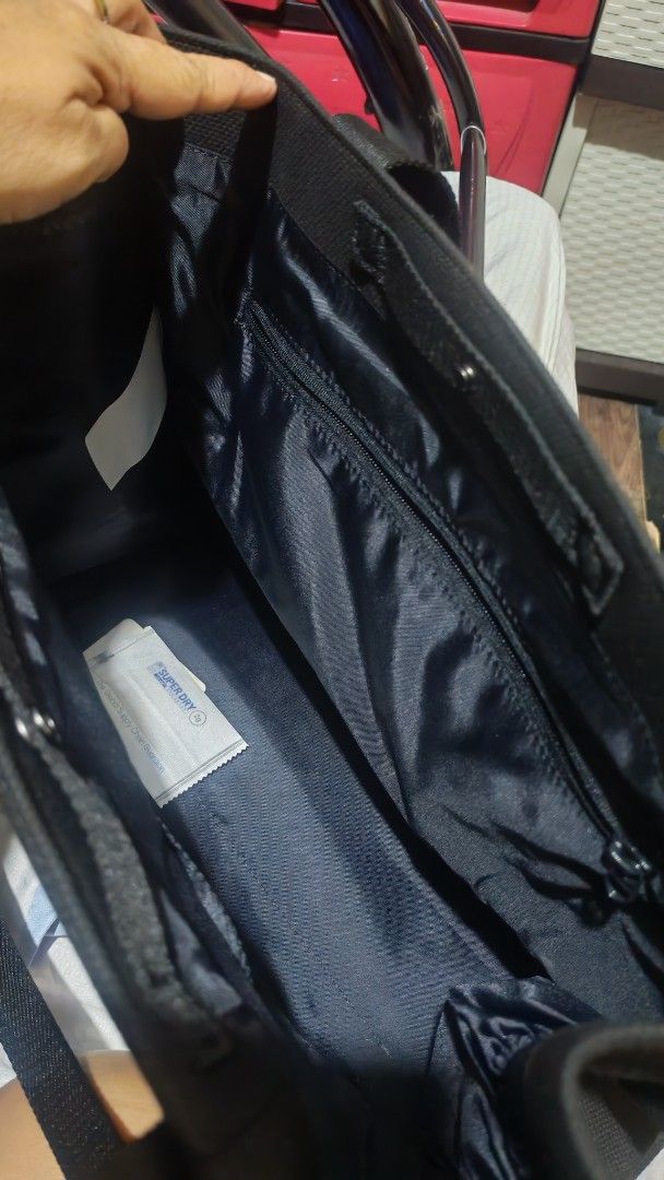 Mondetta Black Canvas Tote Bag (Category: Tote Bags) located in Manila. Submitted by lqndnm.lhen (Listing ID 1460254172, Image 3). Description: - Brand: Mondetta - Color: Black - Material: Canvas - Exterior: Front pocket - Interior: Zippered main compartment, inner zippered pocket, small packet - Features: Sturdy handles - Ideal for: Everyday use, carrying essentials.