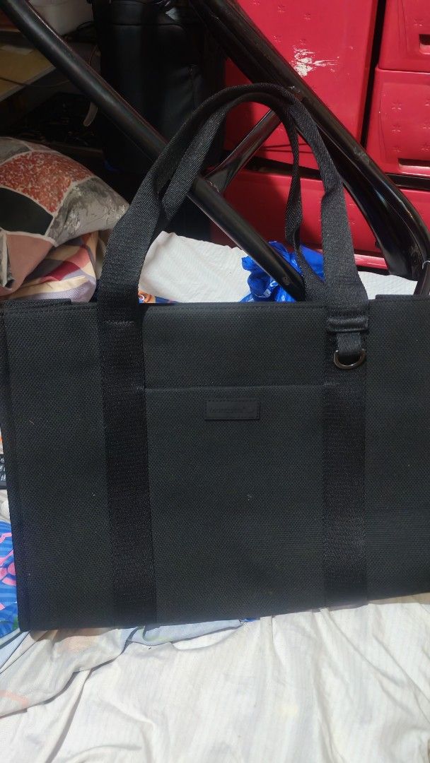 Mondetta Black Canvas Tote Bag (Category: Tote Bags) located in Manila. Submitted by lqndnm.lhen (Listing ID 1460254172, Image 1). Description: - Brand: Mondetta - Color: Black - Material: Canvas - Exterior: Front pocket - Interior: Zippered main compartment, inner zippered pocket, small packet - Features: Sturdy handles - Ideal for: Everyday use, carrying essentials.