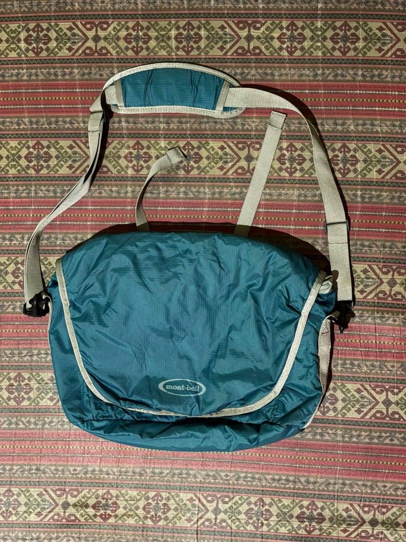 Montbell Teal Blue Messenger Bag (Category: Sling Bags) located in Caloocan City. Submitted by mrk_04 (Listing ID 1460186383, Image 1). Description: - Montbell teal messenger bag - Adjustable strap with shoulder pad - Multiple pockets (inside and out) - Drawstring closure for main compartment - Ideal for everyday use or travel.