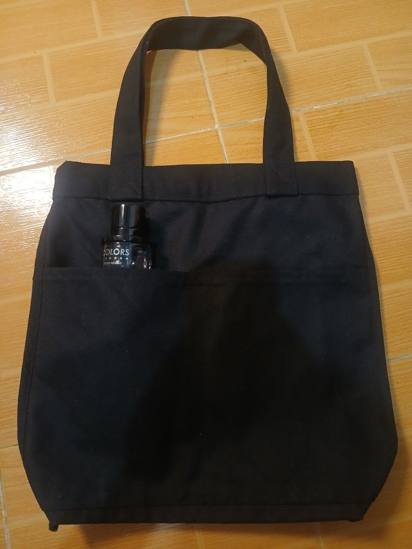 MUJI Black Canvas Tote Bag with Front Pocket (Category: Tote Bags) located in Manila. Submitted by asianwave189184 (Listing ID 1460243713, Image 1). Description: - Simple black canvas tote bag from MUJI - Convenient front pocket - Made in India - Ideal for everyday use - Approximately 14 inches wide - Durable material.