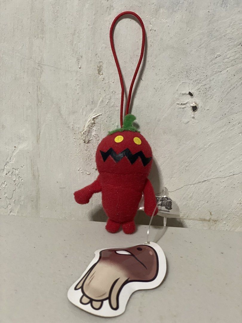 Nameko Plush Keychain (Category: Plushies & Soft Toys) located in Manila. Submitted by kuya_moto (Listing ID 1460279179, Image 1). Description: - Adorable red pepper plush charm - Features a cute green stem and black zig-zag mouth - Comes with a red loop for easy hanging - Includes a separate brown mushroom character sticker - Ideal for decorating bags, backpacks, or keychains.