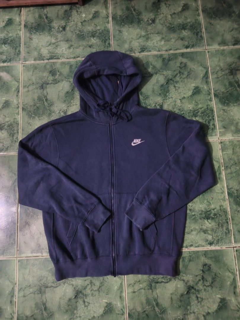 Navy Blue Nike Zip-Up Hoodie (Category: Coats, Jackets and Outerwear) located in Bacoor. Submitted by davealvare39194 (Listing ID 1460223608, Image 1). Description: - Classic navy blue Nike hoodie - Full zip-up front - Drawstring hood - Two convenient front pockets - Comfortable for everyday wear - Ideal for layering.
