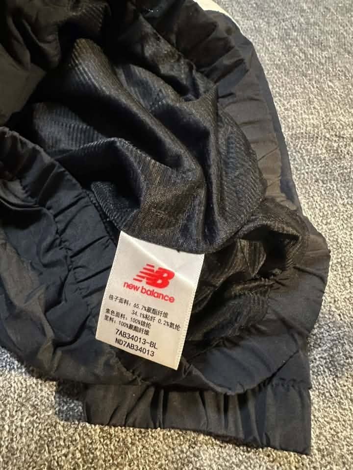 New Balance windbreaker jacket featuring a blue plaid upper (Category: Coats, Jackets and Outerwear) located in Manila. Submitted by thriftedbykab (Listing ID 1460297674, Image 2). Description: ⚙️Size : Medium 💎Condition: 10/10 🚨Color Rate: 10/10 🧨Issue: No ₱350.