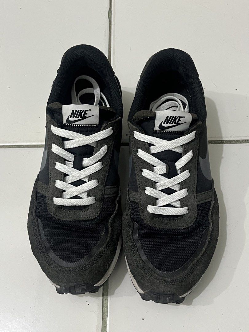 Nike Black and Grey Running Sneakers (Category: Sneakers) located in Manila. Submitted by kayd86043 (Listing ID 1460292726, Image 3). Description: - Pre-loved Nike sneakers - Color: Black and Grey - Style: Lace-up with white laces - Features: Classic Nike swoosh on the side - Ideal for: Casual wear or light jogging - Condition: Shows some signs of wear on soles and uppers.