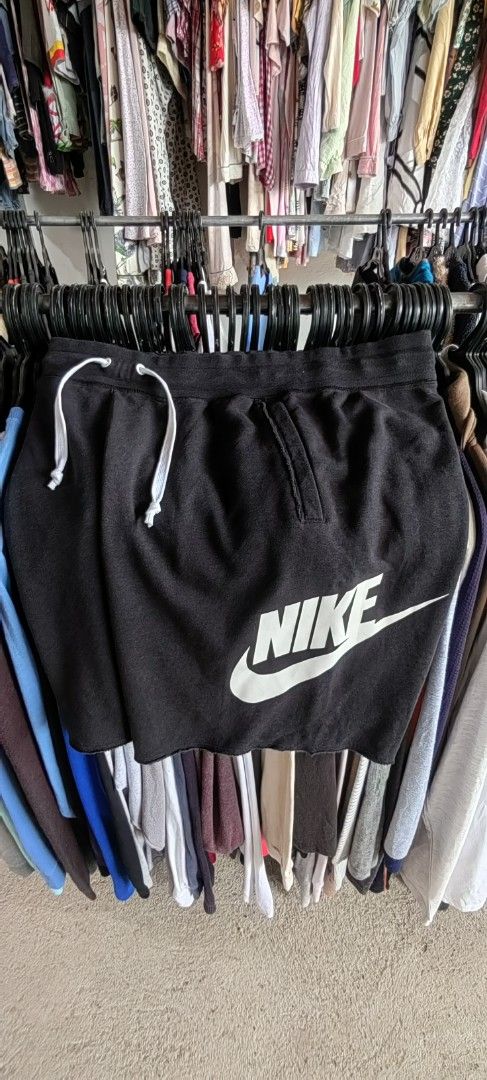 Nike Black Sweat Shorts with White Logo (Category: Shorts) located in Caloocan City. Submitted by dilenb (Listing ID 1460199221, Image 2). Description: - Black Nike sweat shorts - Classic white Nike swoosh logo on the side - Elastic waistband with white drawstring - Features pockets - Made in Thailand - Ideal for lounging or casual wear.