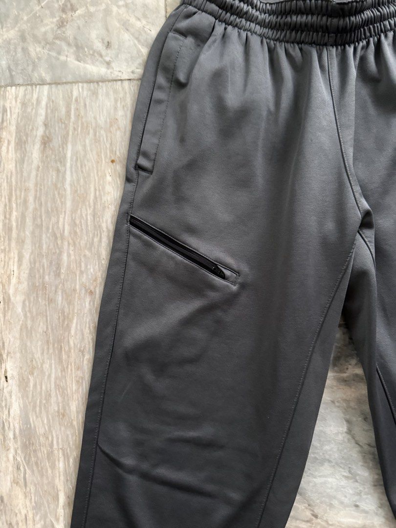 Nike Dri-Fit Grey Athletic Jogger Pants Size M (Category: Joggers) located in San Mateo. Submitted by aifoslvdr (Listing ID 1460142639, Image 3). Description: - Grey Nike Dri-Fit joggers - Elastic waistband with drawstring - Zippered pocket on left thigh - Nike logo on right leg - Size: Medium - Ideal for workouts and casual wear.