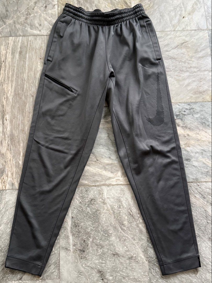 Nike Dri-Fit Grey Athletic Jogger Pants Size M (Category: Joggers) located in San Mateo. Submitted by aifoslvdr (Listing ID 1460142639, Image 1). Description: - Grey Nike Dri-Fit joggers - Elastic waistband with drawstring - Zippered pocket on left thigh - Nike logo on right leg - Size: Medium - Ideal for workouts and casual wear.