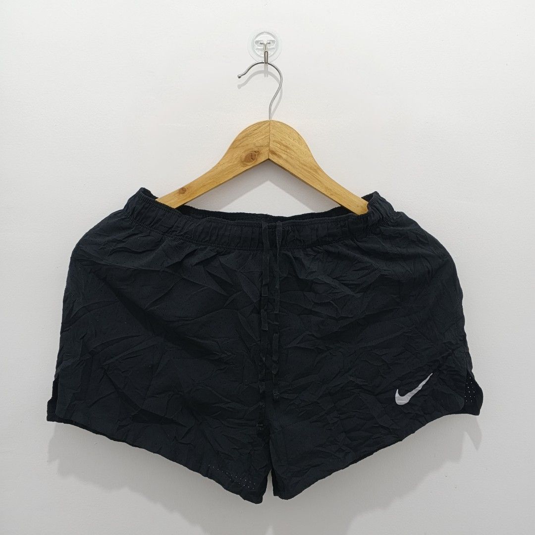 Nike Dri-Fit Running Shorts Black Size M (Category: Activewear) located in Santa Rita. Submitted by papagabs01 (Listing ID 1460166672, Image 1). Description: DIMES WAISTLINE : 26-32 LENGTH : 11-12 (BACK) NO ISSUE‼️ GOOD AS NEW - Black Nike running shorts - Dri-Fit material for sweat-wicking - Size Medium - Adjustable drawstring waist - Perforated side panels for enhanced breathability - Ideal for running and gym workouts.