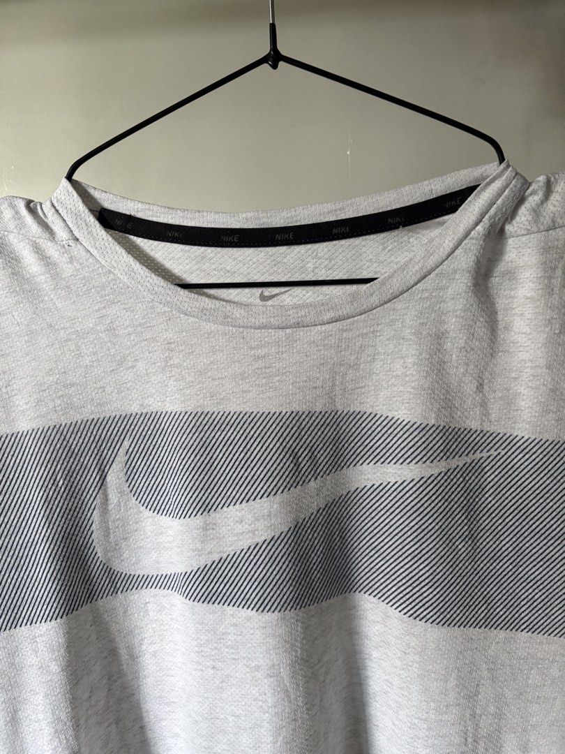 Nike Dri-FIT t-shirt (Category: Activewear) located in General Santos City (Dadiangas). Submitted by artsupply.co (Listing ID 1460139918, Image 2). Description: Size medium on tag Dimension width 21 length 27-29 Excellent condition with no issues Color rate 9/10, color may vary due to lighting Authentic Location general santos city, Mindanao .