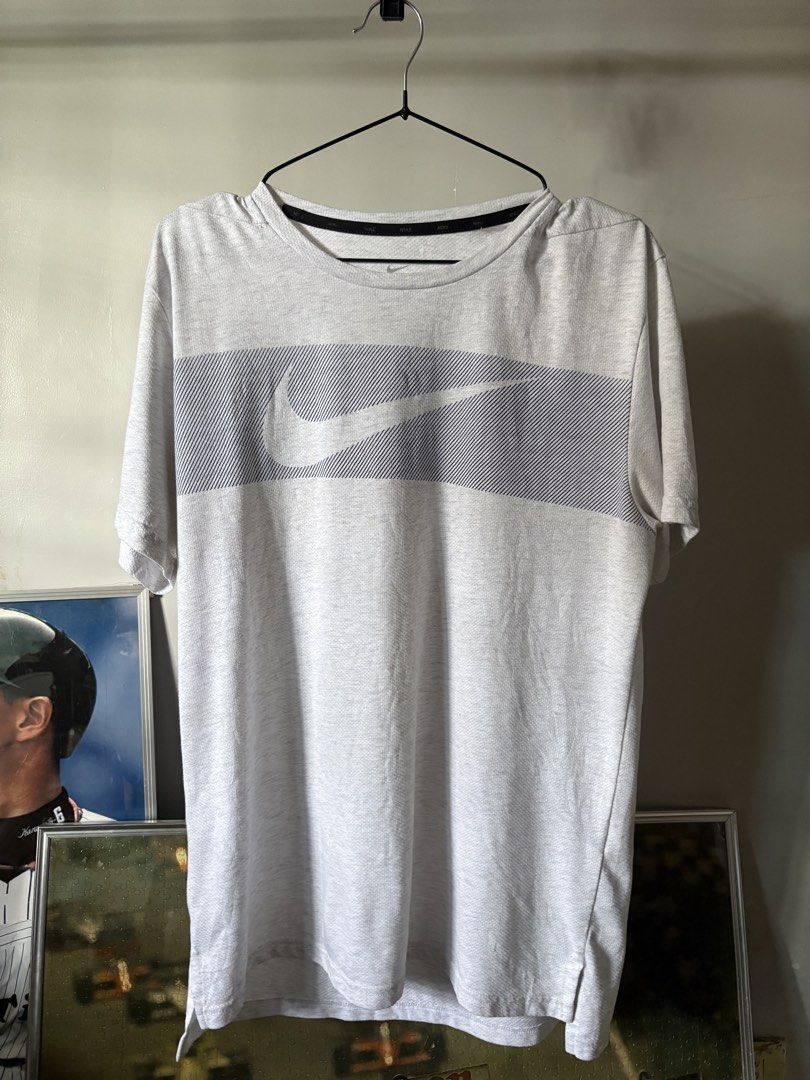 Nike Dri-FIT t-shirt (Category: Activewear) located in General Santos City (Dadiangas). Submitted by artsupply.co (Listing ID 1460139918, Image 1). Description: Size medium on tag Dimension width 21 length 27-29 Excellent condition with no issues Color rate 9/10, color may vary due to lighting Authentic Location general santos city, Mindanao .