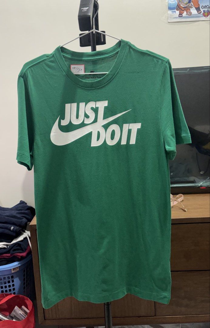 Nike Green Just Do It T-Shirt (Category: Tshirts & Polo Shirts ) located in Manila. Submitted by aj-thrifter (Listing ID 1460207858, Image 1). Description: - Classic green Nike t-shirt - Features iconic 'Just Do It' graphic - Comfortable cotton fabric - Short sleeves and crew neck design - Versatile for casual outfits or athletic activities - Easy to pair with jeans, shorts, or athletic bottoms - A wardrobe essential - 19-29.