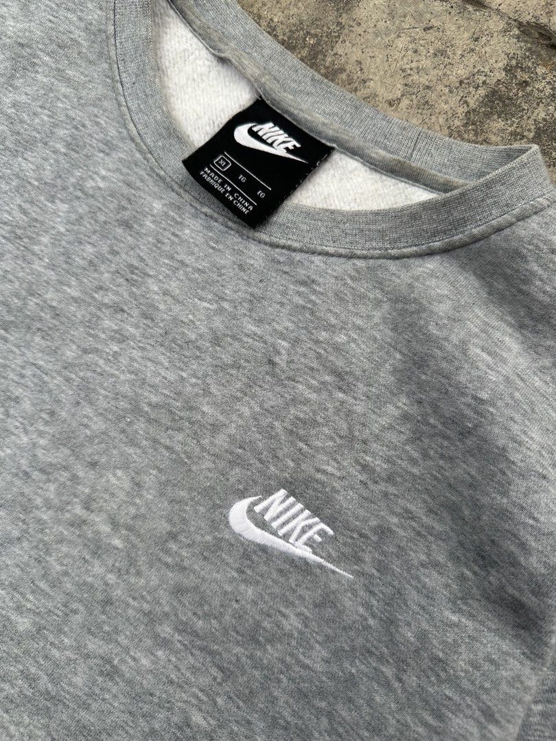 Nike Grey Crewneck Sweatshirt XL (Category: Coats, Jackets and Outerwear) located in Padada. Submitted by jevanie1234 (Listing ID 1460267500, Image 2). Description: - Grey Nike crewneck sweatshirt - Small embroidered Nike logo on chest - Made in China - Material: 80% cotton, 20% polyester - Size: XL - Ideal for casual wear.