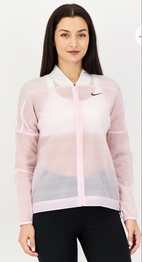 Nike Pink Sheer Windbreaker Jacket (Category: Coats, Jackets and Outerwear) located in Manila. Submitted by peacd (Listing ID 1460155670, Image 3). Description: - Light pink sheer Nike jacket - White collar and sleeve panels - Large Nike graphic with green flower logo on back - Zip-up front - Ideal for layering or light workouts - Size Medium.