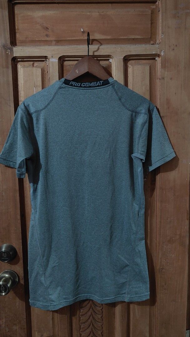 Nike Pro Combat Dri-Fit Compression T-Shirt XL (Category: Activewear) located in Trece Martires City. Submitted by vjcarungcong (Listing ID 1460229083, Image 2). Description: - Grey Nike Pro Combat Dri-Fit T-shirt - Size: XL - Style: Short sleeves, crew neck - Fit: Compression - Material: Dri-Fit technology for sweat-wicking - Origin: Made in China - Ideal for: Workouts, sports, or everyday casual wear -brand new.