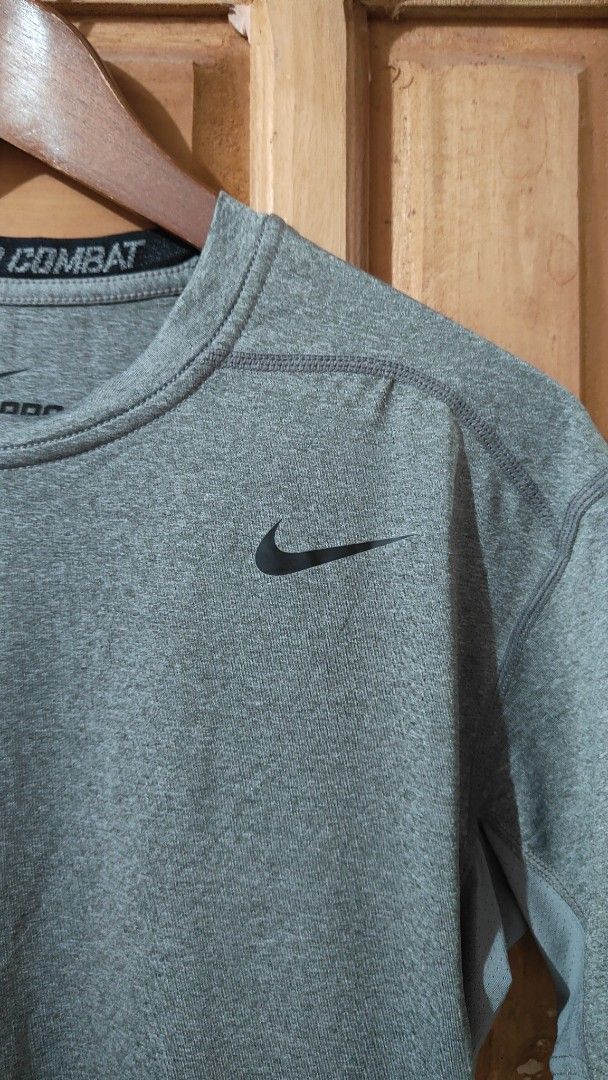 Nike Pro Combat Dri-Fit Compression T-Shirt XL (Category: Activewear) located in Trece Martires City. Submitted by vjcarungcong (Listing ID 1460229083, Image 3). Description: - Grey Nike Pro Combat Dri-Fit T-shirt - Size: XL - Style: Short sleeves, crew neck - Fit: Compression - Material: Dri-Fit technology for sweat-wicking - Origin: Made in China - Ideal for: Workouts, sports, or everyday casual wear -brand new.