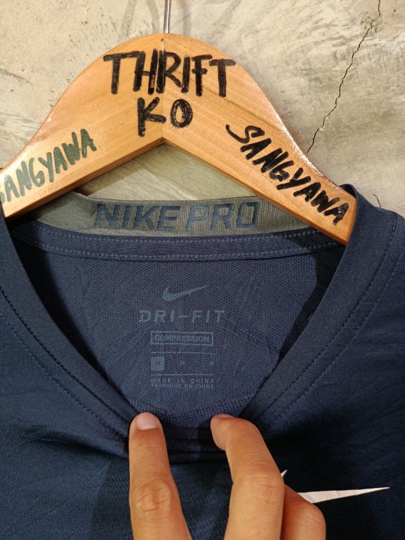Nike Pro Dri-Fit Compression Long Sleeve Shirt (Category: Activewear) located in Kalamansig. Submitted by skone1996 (Listing ID 1460249492, Image 2). Description: - Navy blue Nike Pro Dri-Fit compression long sleeve shirt - Size: Medium (M) - 16 Width - 26 Length - 10/10 Color rate - No Issue - Ideal for workouts, sports, and athletic activities - Dri-Fit technology for breathability, keeping you cool and dry - Features the iconic Nike swoosh log