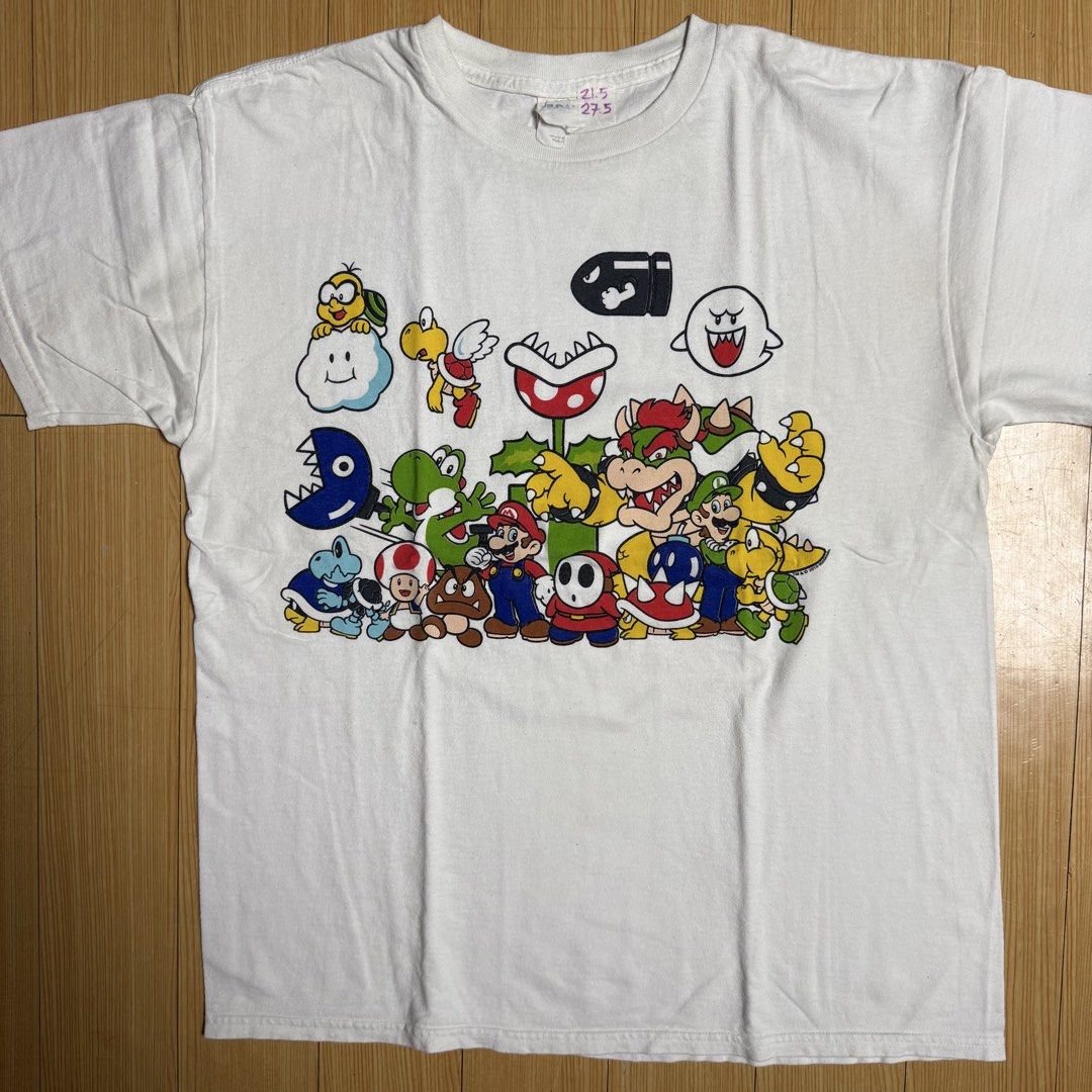 Nintendo Super Mario T-Shirts (Bundle) (Category: Tshirts & Polo Shirts ) located in Rizal. Submitted by shirtguy78 (Listing ID 1460291084, Image 2). Description: - Bundle of three Nintendo Super Mario t-shirts. - Black shirt features a Bullet Bill graphic. - White shirt showcases various characters: Mario, Luigi, Bowser, and Yoshi. - Blue shirt has a design of Mario and gold coins. - Ideal gift for any Super Mario enthusiast. - can be sold separ