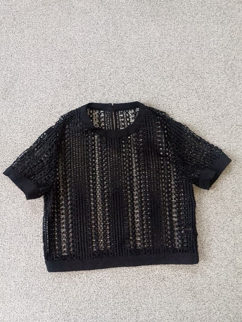 OCHIRLY Black Mesh Crop Top (Category: Blouses) located in Cabadbaran. Submitted by ztsfinds (Listing ID 1460129566, Image 1). Description: -Worn over a camisole, bralette or tank top. -a black hollow-cut mesh crop top. -This is curated ukay clothes, already washed. -Size: Small (160/84A) -Length: 47 cm -Width laid flat: 45 cm.