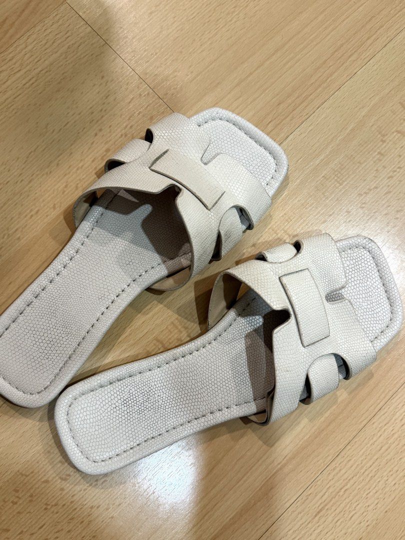 Off-White Textured Cutout Slide Sandals | Pre-Loved (Category: Flats & Sandals) located in Muntinlupa City. Submitted by alexisofia (Listing ID 1460287712, Image 2). Description: Chic and versatile unbranded flat slide sandals in a clean off-white tone. Features an H-style/cutout strap design with a subtle snakeskin/pebbled texture and a square-toe finish. ✨ Brand: Unbranded / No Brand ✨ Size: Fits US 7.5 - 8 / EUR 38 (Free size/Standard fit) ✨ C