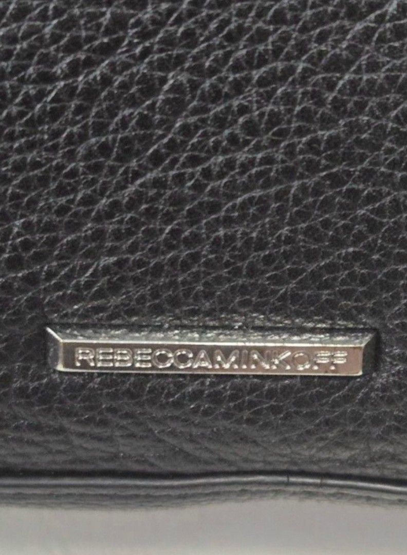 OG Rebecca Minkoff Black Leather Bag (Category: Luxury Bags & Wallets) located in Manila. Submitted by affordabags_cd (Listing ID 1460227671, Image 3). Description: - Genuine black leather tote bag by Rebecca Minkoff - Versatile carrying options: top handles and detachable crossbody strap - Secure zipper closure for your belongings - Chic fringe detailing on the sides - Spacious interior, ideal for everyday essentials.