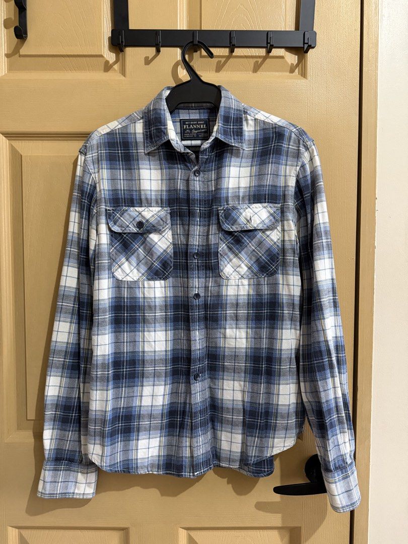Blue and White Plaid Flannel Shirt (Category: Tshirts & Polo Shirts ) located in Manila. Submitted by chavirly (Listing ID 1460193191, Image 1). Description: - Classic blue and white plaid flannel shirt - Long sleeves with button cuffs - Two chest pockets with button closures - Two extra buttons still intact inside the shirt - Versatile for layering or wearing solo - Comfortable and durable material.