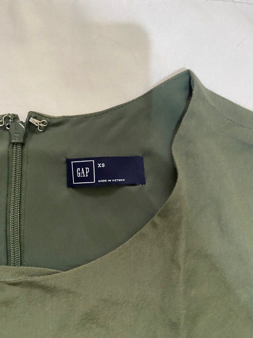 Olive Green Flared Dress (Category: Dresses) located in Las Pinas. Submitted by shairaadriannx (Listing ID 1460137731, Image 2). Description: - Brand: GAP - Color: Olive Green - FITS XS-S - Style: Flared hem, short sleeves - Closure: Back zipper - Occasion: Casual or dressy.