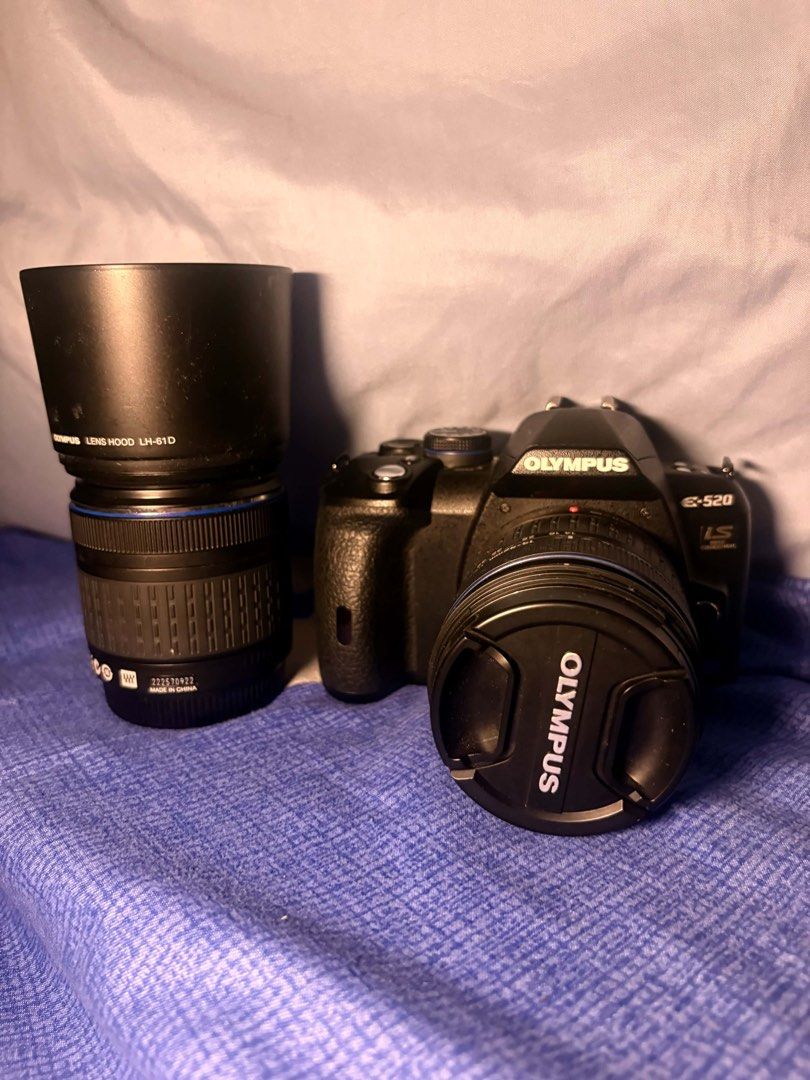 Olympus E-520 DSLR Camera Bundle (Category: Cameras) located in Baliuag. Submitted by br0kebaddieng (Listing ID 1460259197, Image 1). Description: negotiable if sure buyer Condition: Working well, clean glass. What’s Included: Olympus E-520 DSLR Body Zuiko Digital 14-42mm f/3.5-5.6 lens Zuiko Digital 40-150mm f/4-5.6 telephoto lens Lens hood and caps Battery Charger SD/Compact Card.