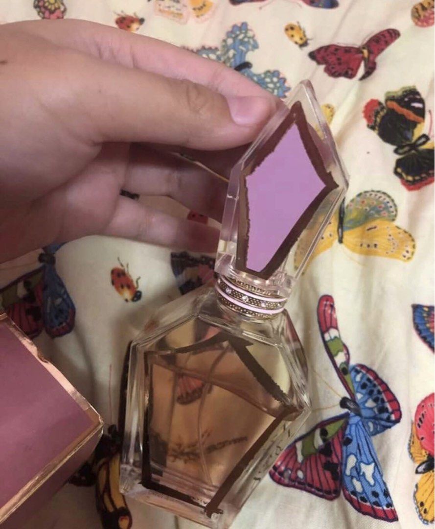One Direction You & I Eau de Parfum 50ml with Ring (Category: Fragrance & Deodorants) located in Bacoor. Submitted by mysticturtle_1614dc (Listing ID 1460243684, Image 2). Description: - One Direction You & I Eau de Parfum (50ml) - Includes a cute, gold ring with pink and sparkly details - Original box features photos of the One Direction boys - Gem-shaped perfume bottle - Perfect gift for any Directioner!.