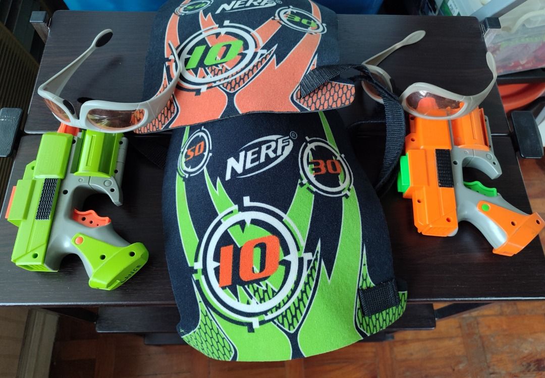 Original Nerf Dart Tag FuryFire COMPLETE 2 Player Set (Category: Action & Battle Toys) located in Mandaluyong City. Submitted by thethrifthaul (Listing ID 1460167052, Image 1). Description: - Complete Nerf battle set! - Includes 2 Nerf furyfire blasters--both working - thicker ABS plastic shells -2 Nerf vision gear protective eyewear - 2 Nerf Dart Tag Scoring Vests - All items are genuine Nerf brand - Perfect for exciting Nerf battles!.
