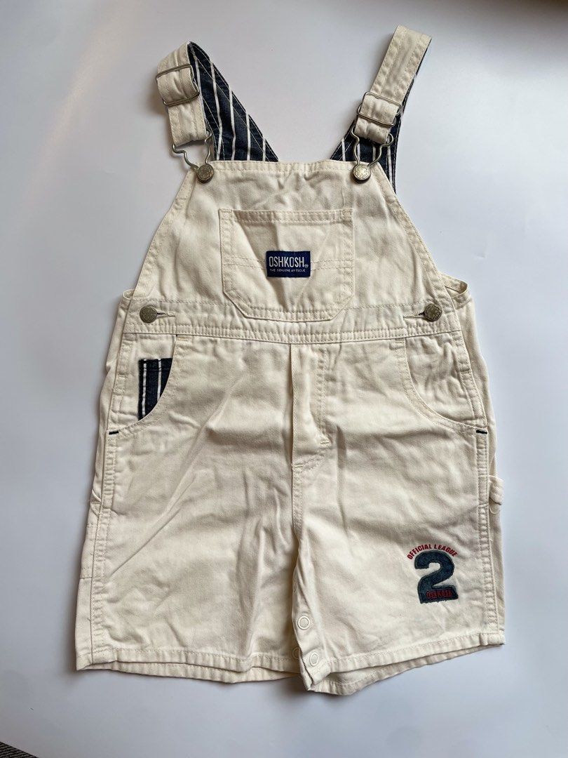 OshKosh B'gosh Cream Shortalls Size 95 (Category: Babies & Kids Fashion) located in Calamba. Submitted by thriftbygab2nd (Listing ID 1460257124, Image 1). Description: - Cream OshKosh B'gosh shortalls - Size: 95 - 'Official League' patch with number 2 on the leg - Striped lining on straps - Snap closure at inseam for easy diaper changes - Ideal for summer wear.