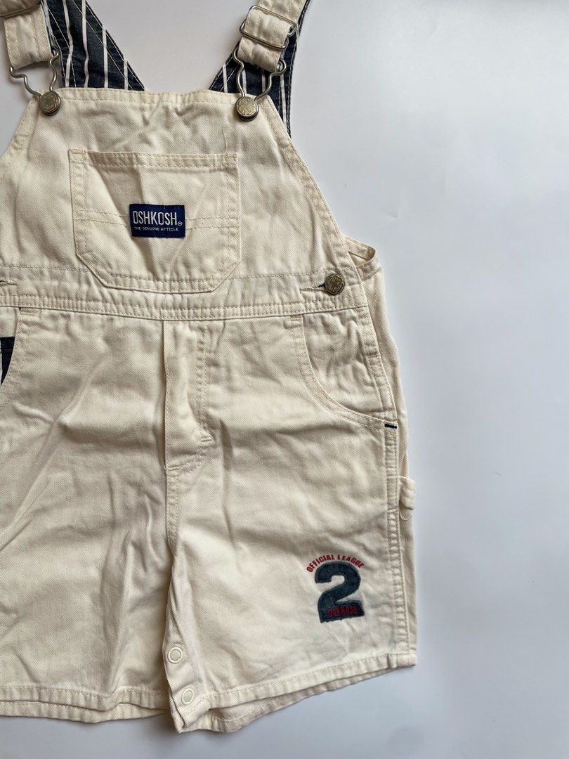 OshKosh B'gosh Cream Shortalls Size 95 (Category: Babies & Kids Fashion) located in Calamba. Submitted by thriftbygab2nd (Listing ID 1460257124, Image 2). Description: - Cream OshKosh B'gosh shortalls - Size: 95 - 'Official League' patch with number 2 on the leg - Striped lining on straps - Snap closure at inseam for easy diaper changes - Ideal for summer wear.