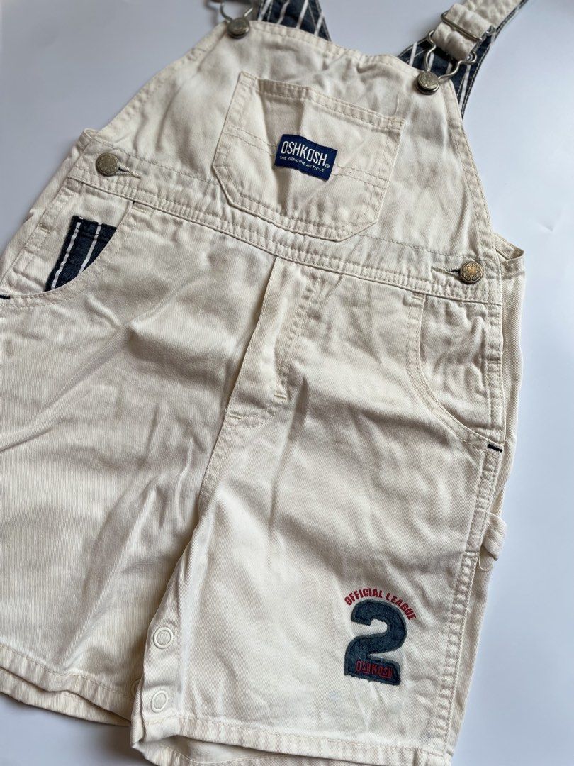 OshKosh B'gosh Cream Shortalls Size 95 (Category: Babies & Kids Fashion) located in Calamba. Submitted by thriftbygab2nd (Listing ID 1460257124, Image 3). Description: - Cream OshKosh B'gosh shortalls - Size: 95 - 'Official League' patch with number 2 on the leg - Striped lining on straps - Snap closure at inseam for easy diaper changes - Ideal for summer wear.
